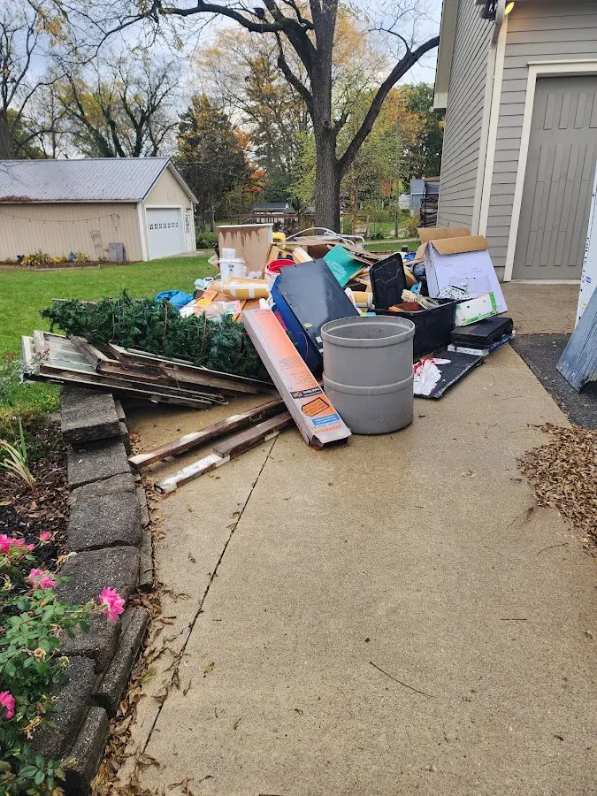 Dumpster being loaded with debris for 3 Yard Dumpster Rental in Upper Sandusky